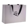 The white handbag is a simple and solid-colored eco-friendly shopping bag with a large capacity and foldable portability Item Picture